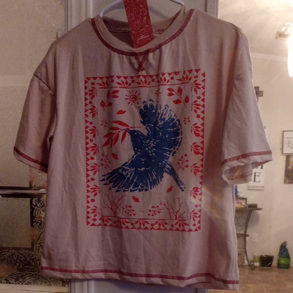 SHEIN Beige Tee with Blue Bird and Red Accents
